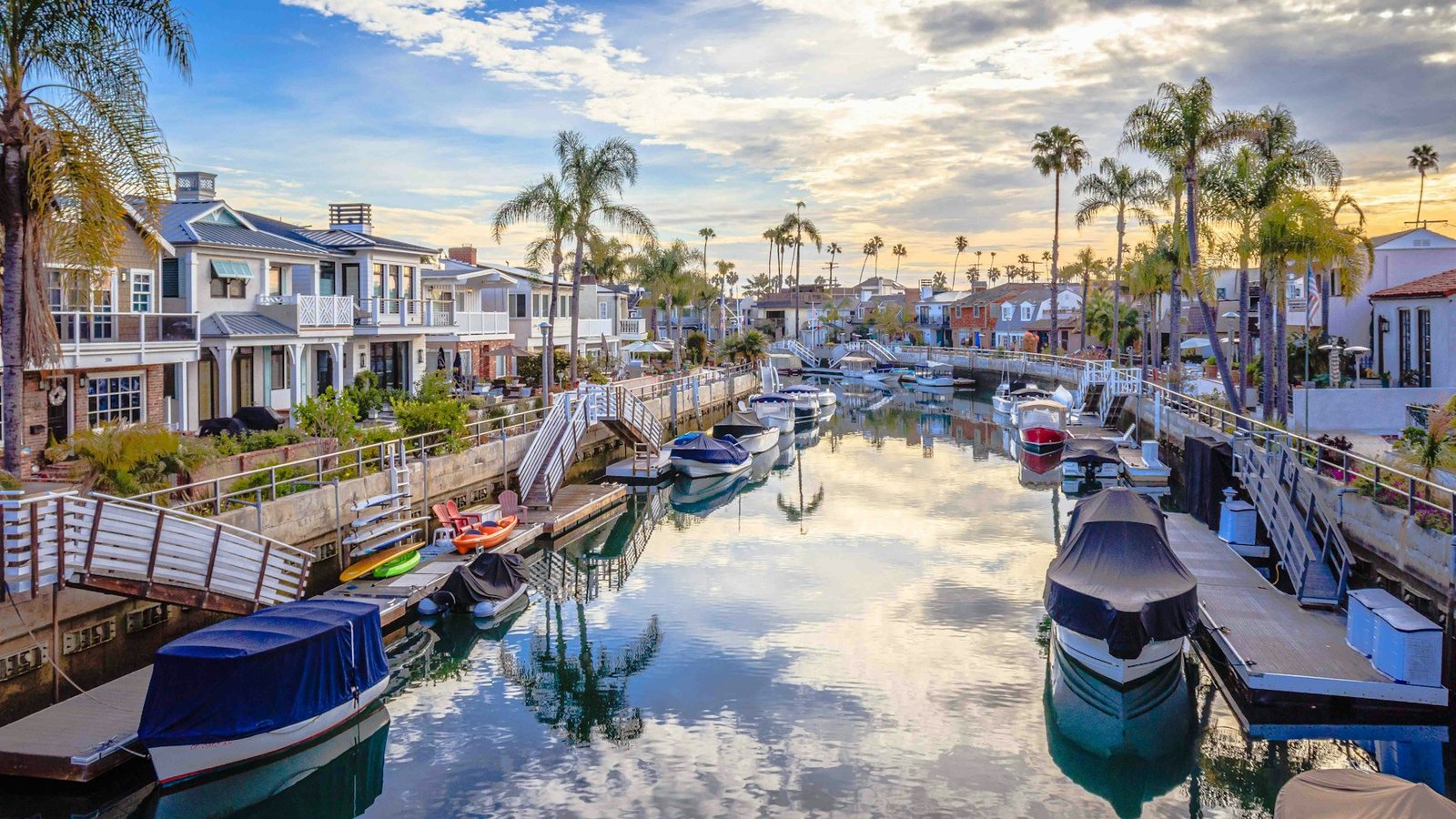 Boats on a palm-lined waterway