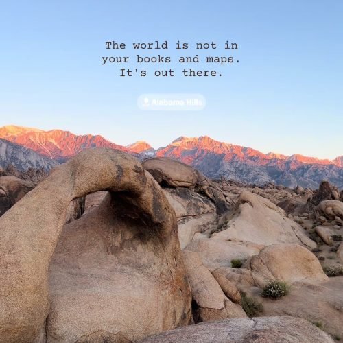 Rounded Alabama Hills boulders beneath sunlit Sierra Nevada peaks
