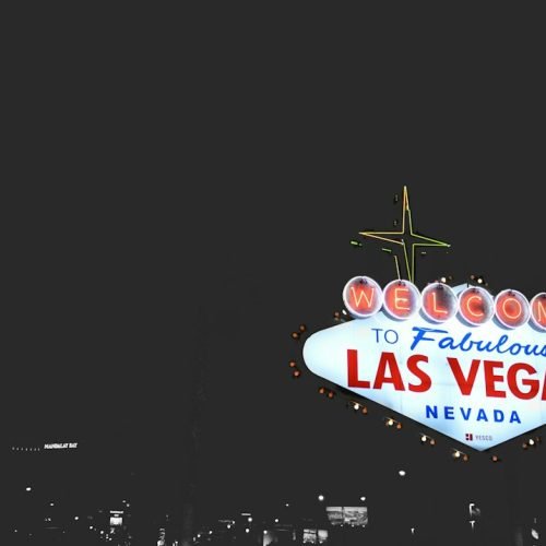 The Welcome to Fabulous Las Vegas sign illuminated against the night sky